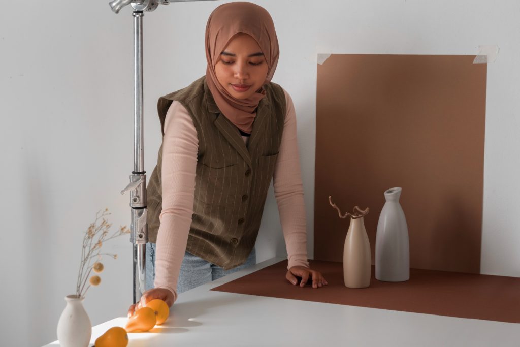 a muslim maid cleaning a table